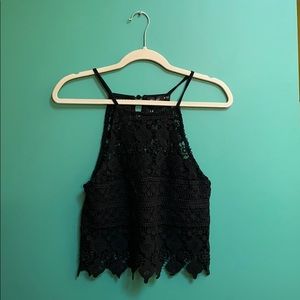Small black crochet halter crop top.